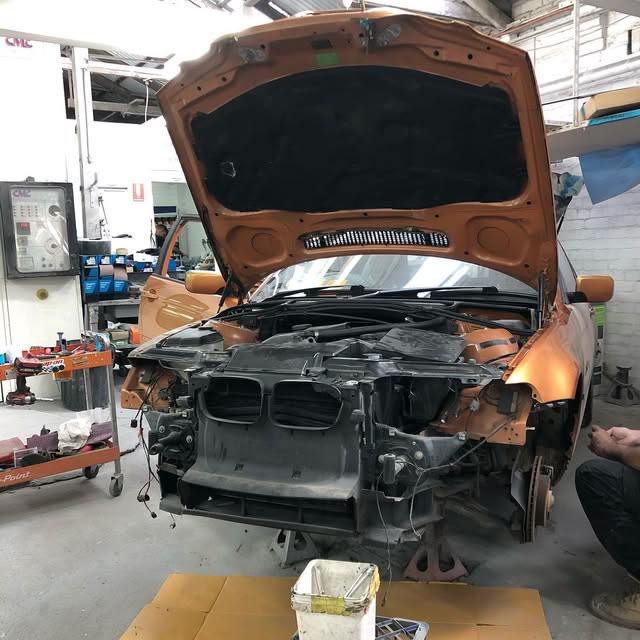 Vehicle undergoing body repair inside the Cammeray Smash Repairs workshop