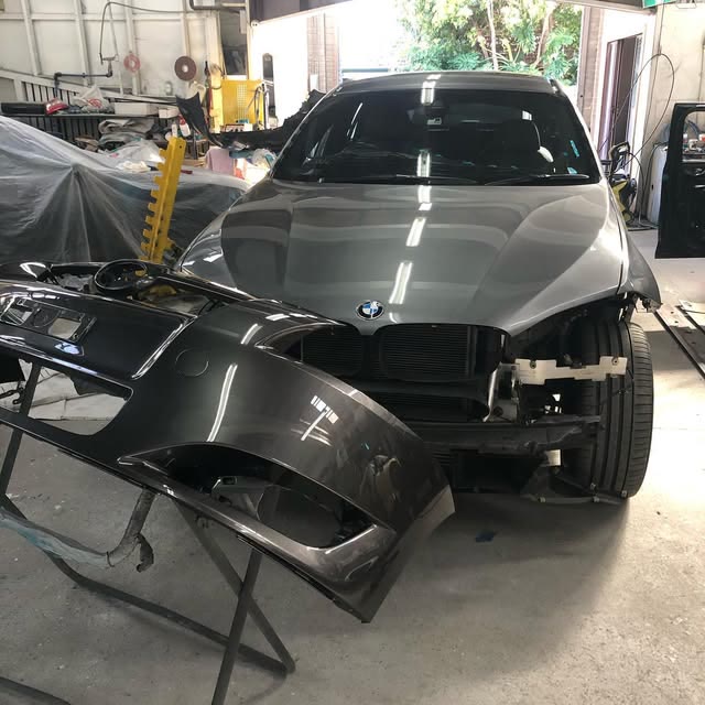 Vehicle with front bumper removed in the Cammeray Smash Repairs workshop